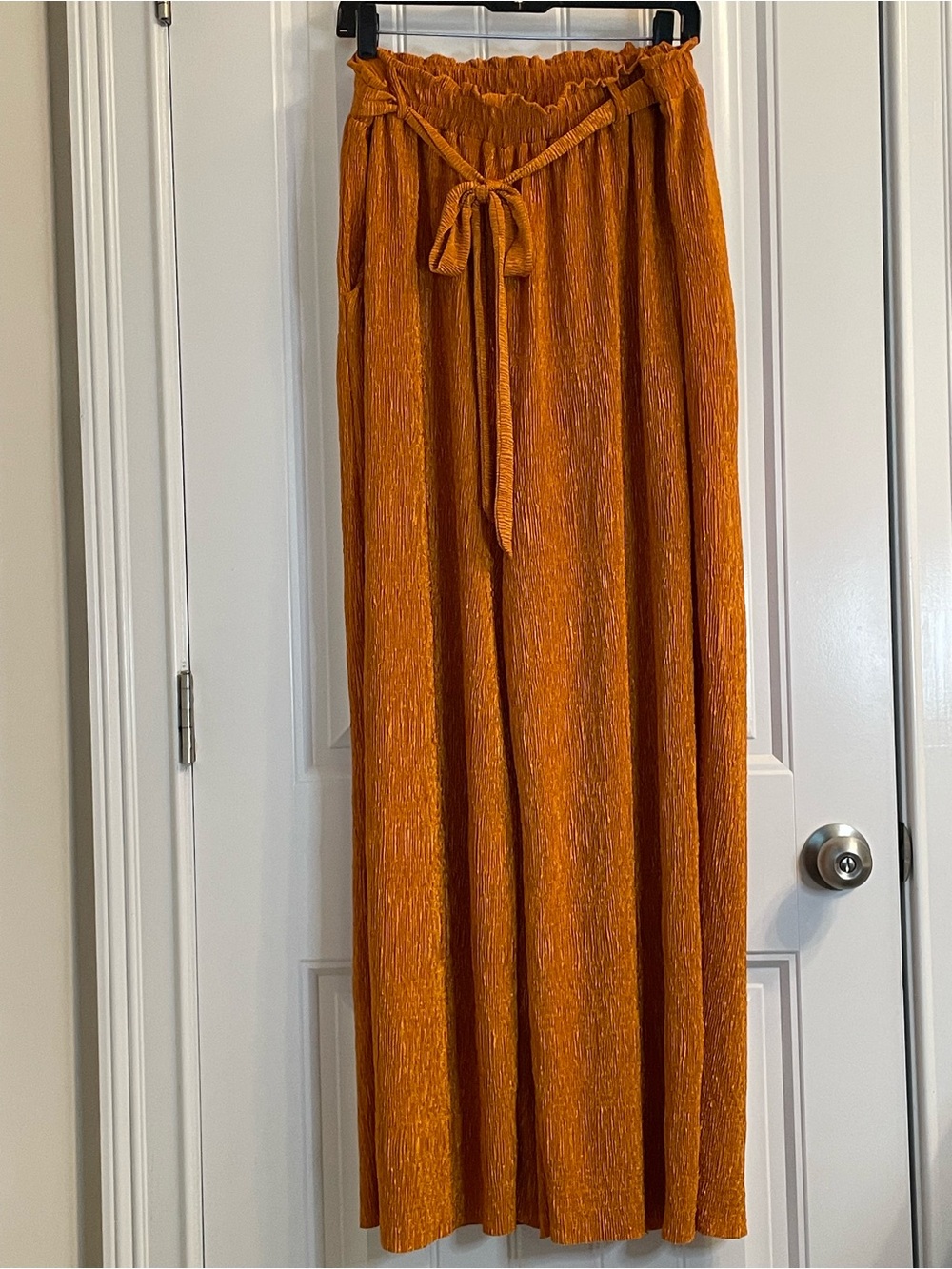 LuLaRoe “Diane” Burnt Orange Wide-Leg Pull-On Pants with side pockets.